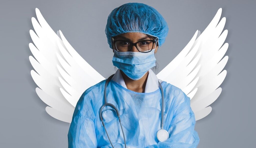 A doctor stand infront of created angel wings