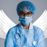 A doctor stand infront of created angel wings
