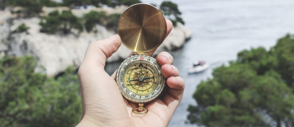 A compass in hand