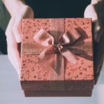 A gift box tied with ribbon is given