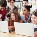 The students studying with the help of laptops