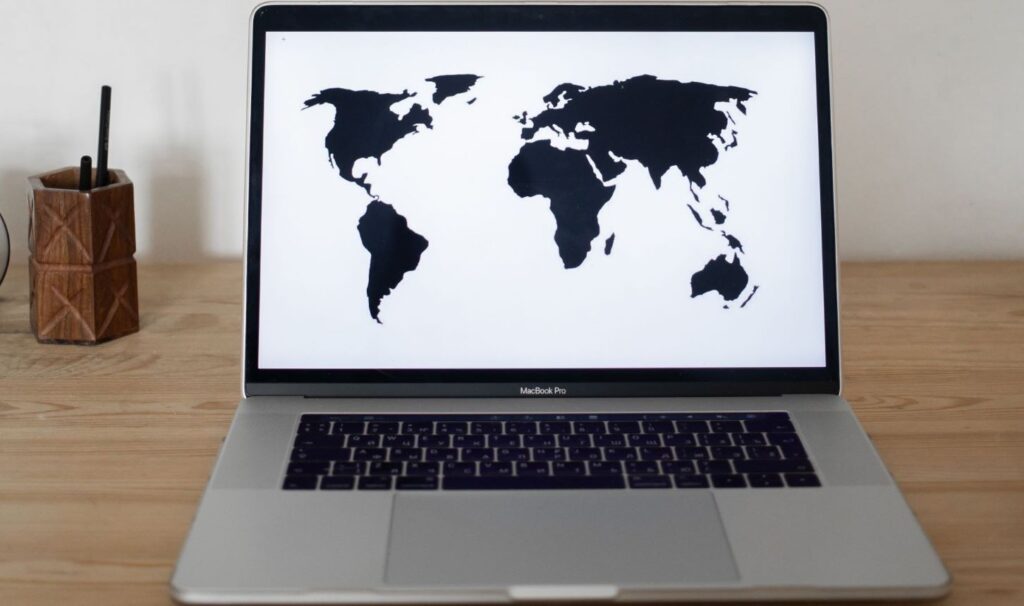 A laptop showing world map
