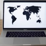 A laptop showing world map