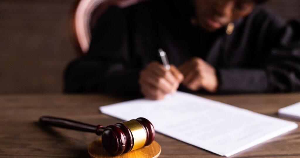 The judge writing judgement