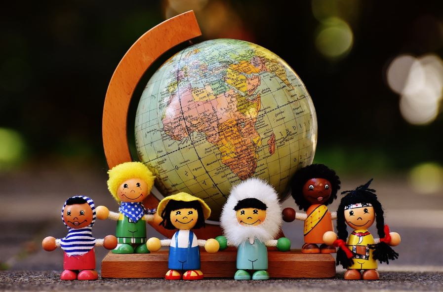 The globe and toys like children in different countries