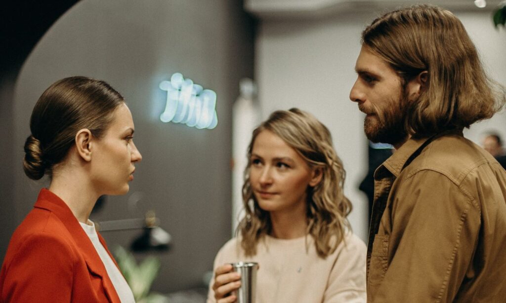 Three persons are talking