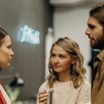 Three persons are talking