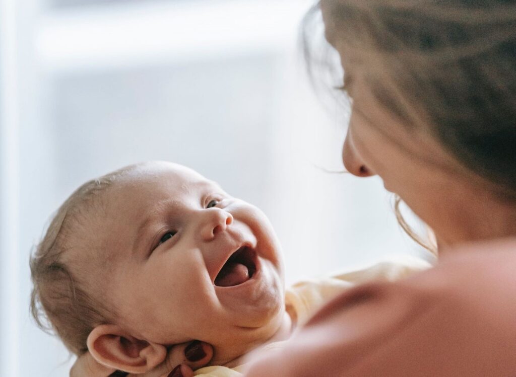 The new born baby and mother are happy about to see each other