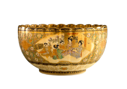 A golden colour bowl with Japanese colourful art