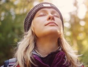 A woman feels within herself A woman who closes her eyes and feels inside herself